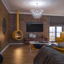 Foto de ambiente de la chimenea exenta de bioetanol de Infire INCYRCLE, color amarillo