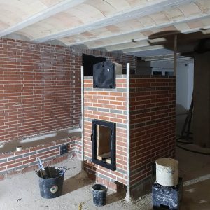 Etapa en la autoconstrucción de una estufa rocket con el servicio de asesoramiento a autoconstructores