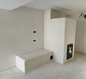 Ejemplo de estufa de inercia rocket moderna con banco acabado en cal