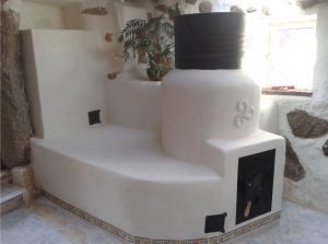 Ejemplo de estufa de inercia rocket con banco y bidón